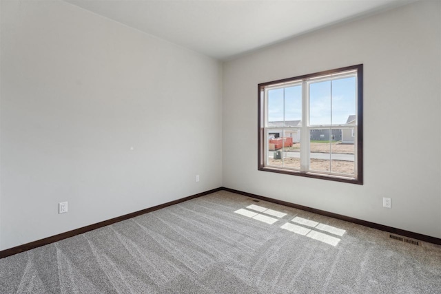 3868 E Teton Ln, Appleton, WI 54913 - carpeted empty room with baseboards and visible vents