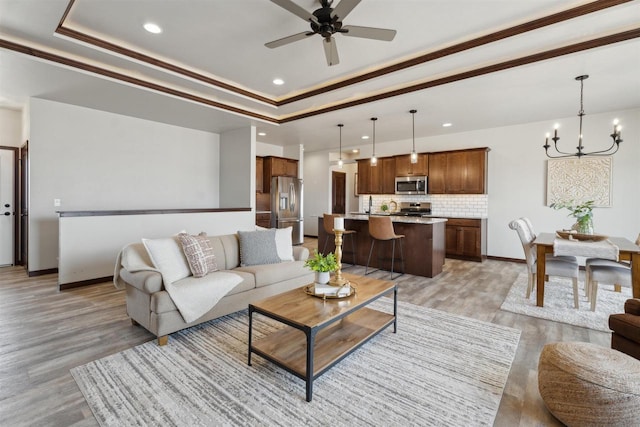 3868 E Teton Ln, Appleton, WI 54913 - living area with recessed lighting, ceiling fan with notable chandelier, and a tray ceiling
