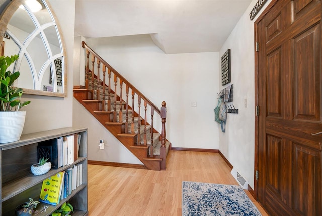 foyer entrance with light wood-type flooring