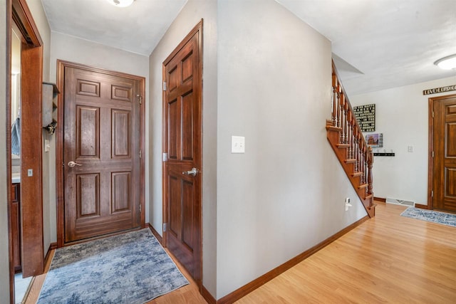 foyer with light hardwood / wood-style flooring