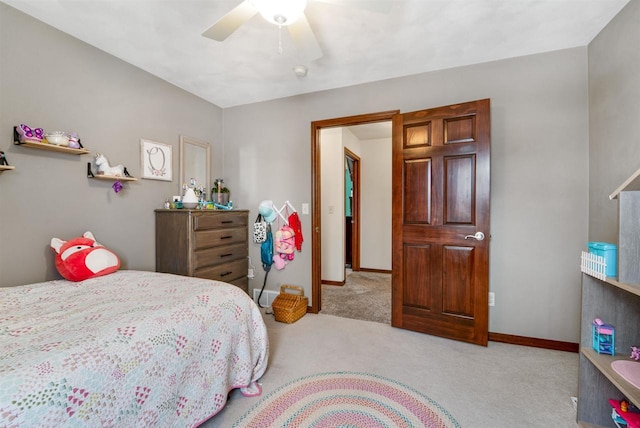 bedroom featuring light carpet and ceiling fan