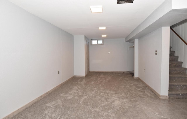 basement featuring carpet flooring