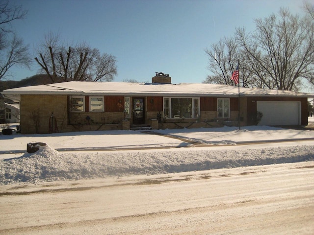 ranch-style home featuring a garage