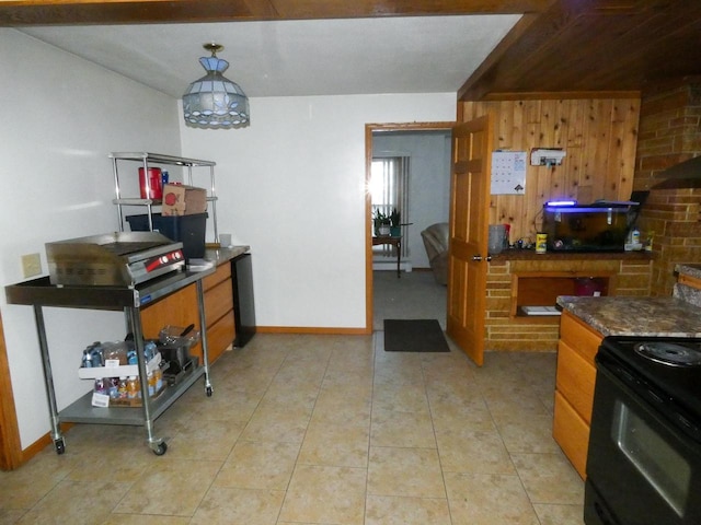 kitchen featuring black electric range and light tile patterned flooring