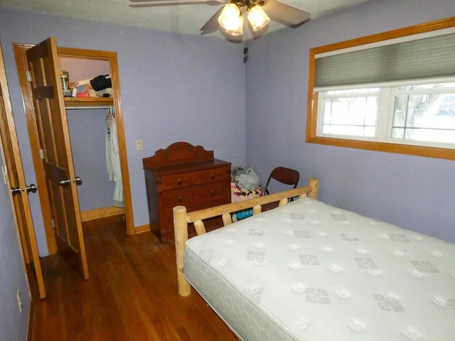 bedroom with ceiling fan and dark wood-type flooring