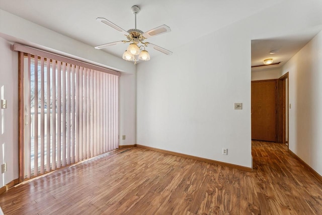 unfurnished room with hardwood / wood-style flooring and ceiling fan