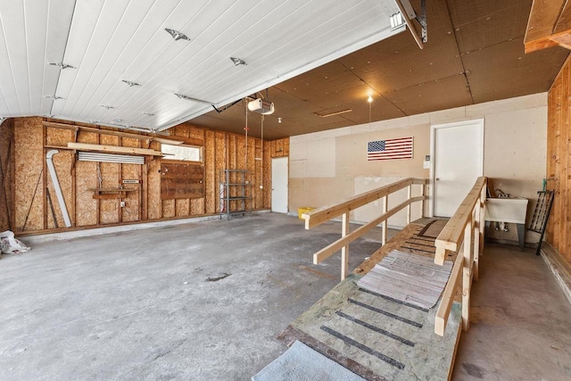 garage featuring sink and a garage door opener