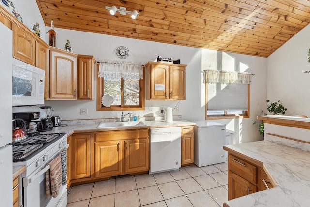 kitchen featuring white appliances, light tile patterned flooring, vaulted ceiling, wooden ceiling, and sink