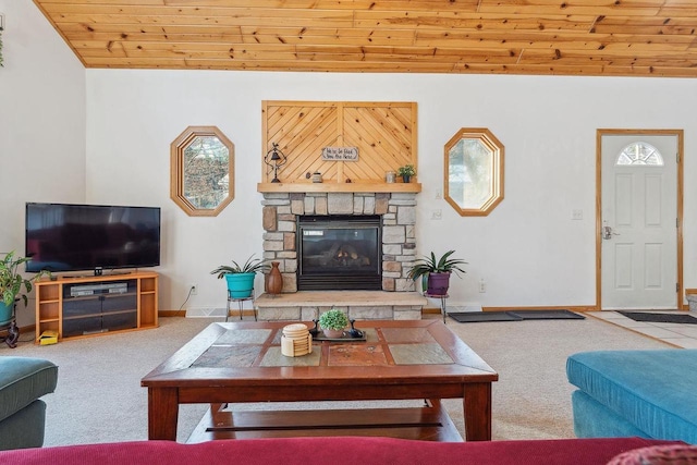 carpeted living room with vaulted ceiling, wooden ceiling, and a stone fireplace