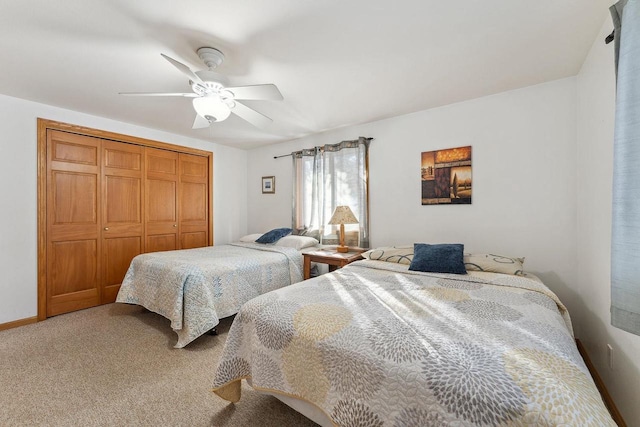 bedroom with carpet, a closet, and ceiling fan