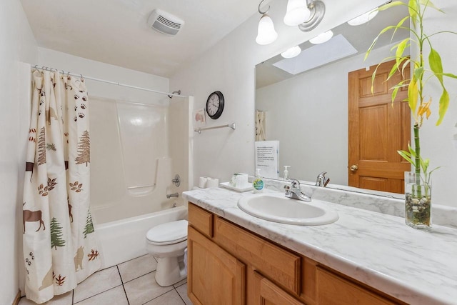 full bathroom with tile patterned flooring, toilet, shower / tub combo, a skylight, and vanity