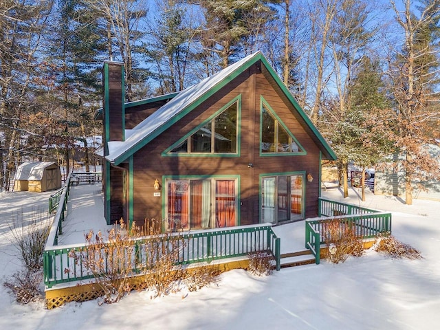 view of front of house featuring a storage shed