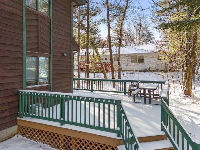 view of snow covered deck