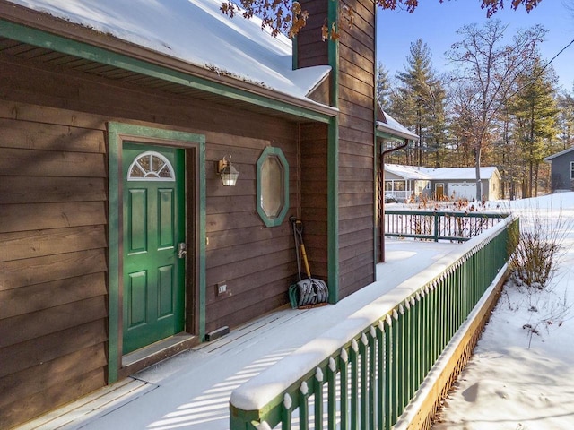 view of snow covered property entrance