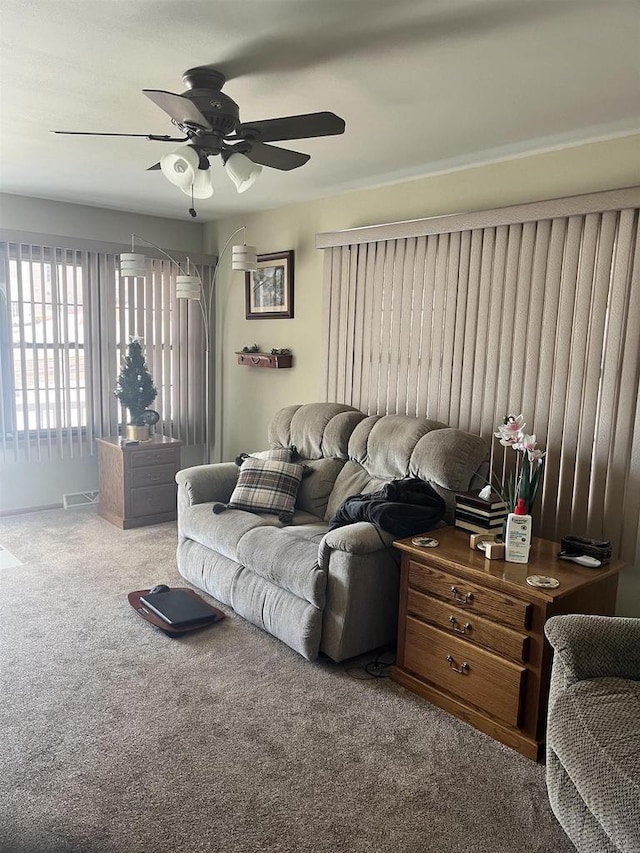 living room with carpet and ceiling fan