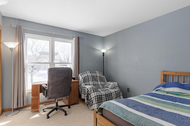 bedroom with light carpet and multiple windows