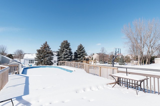 view of snow covered pool