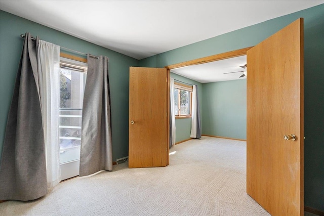 bedroom featuring light colored carpet