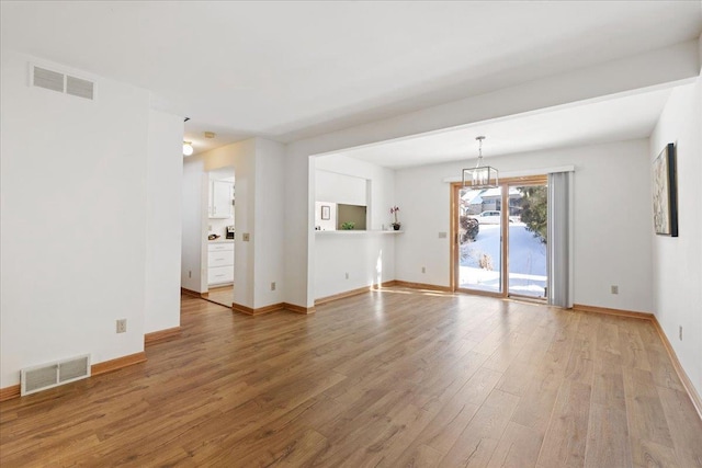 unfurnished room with hardwood / wood-style floors