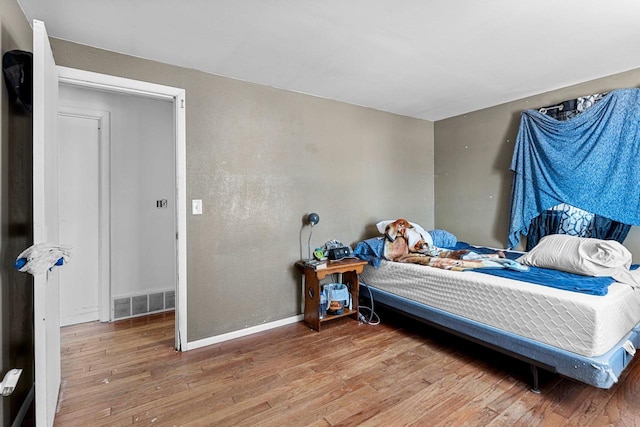 bedroom featuring hardwood / wood-style floors