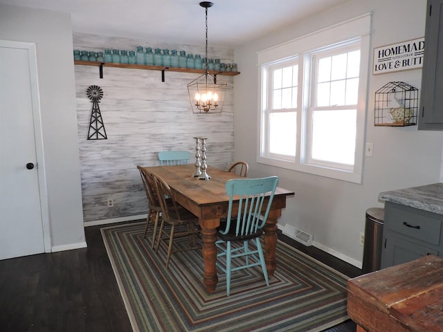 dining space with dark wood-type flooring