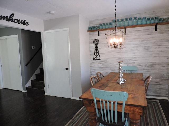 dining area featuring a chandelier and dark hardwood / wood-style flooring