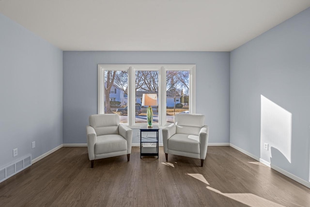 living area with dark hardwood / wood-style flooring