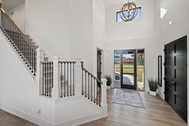 foyer featuring a chandelier and light hardwood / wood-style floors