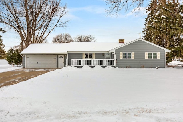 single story home with a garage and a porch