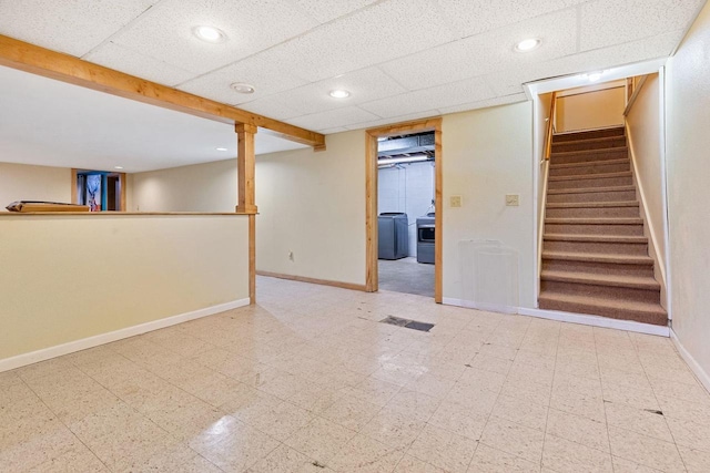 basement featuring a paneled ceiling