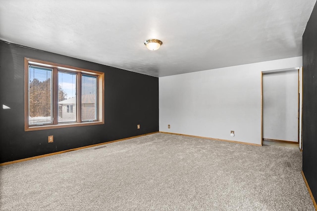 unfurnished room featuring carpet floors