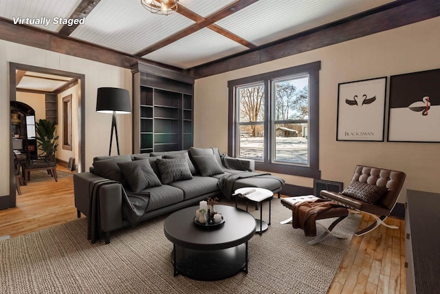 living room with coffered ceiling, beamed ceiling, and wood-type flooring