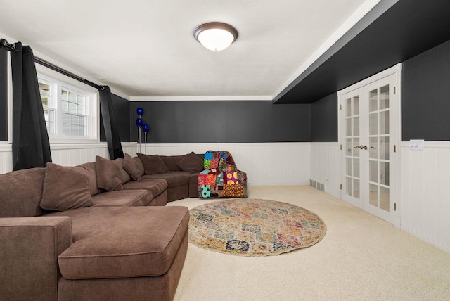 carpeted living room featuring french doors