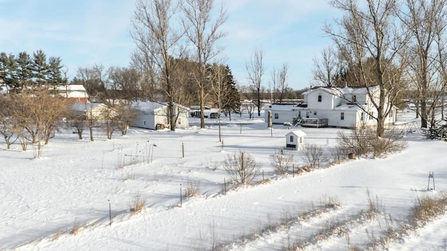 view of yard layered in snow