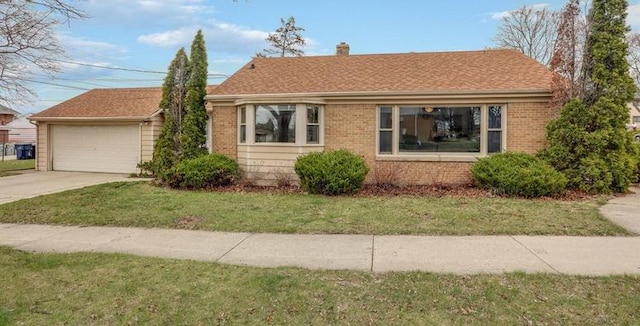 view of front facade featuring a garage, a front yard, a chimney, and brick siding