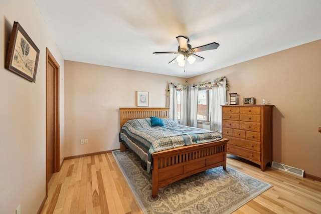 bedroom featuring light hardwood / wood-style floors and ceiling fan