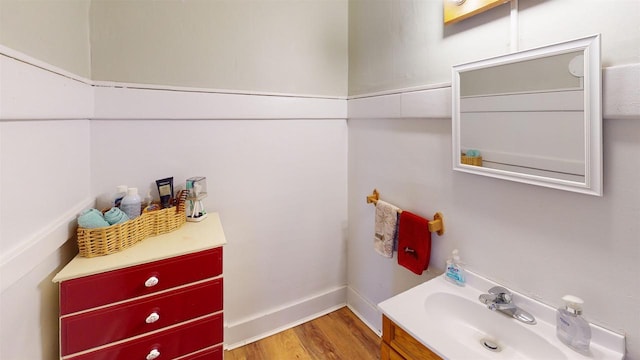 bathroom with vanity and wood-type flooring