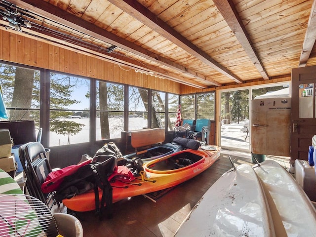 sunroom featuring beamed ceiling, a wealth of natural light, and wooden ceiling