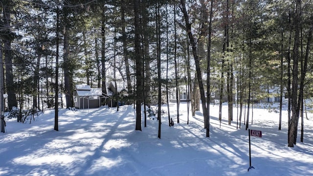 view of yard layered in snow