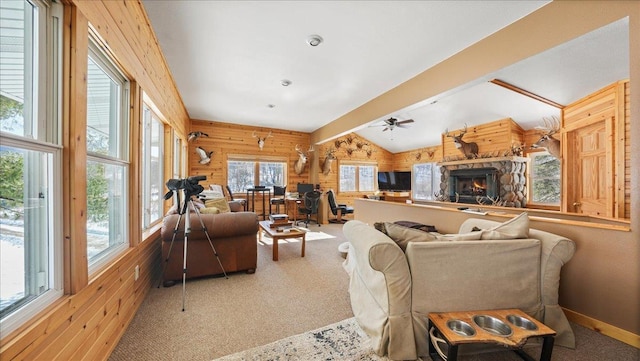 living area with wood walls, light carpet, and lofted ceiling with beams