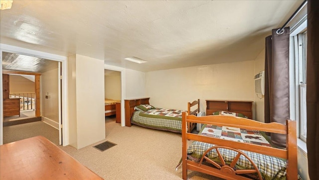 carpeted bedroom with visible vents