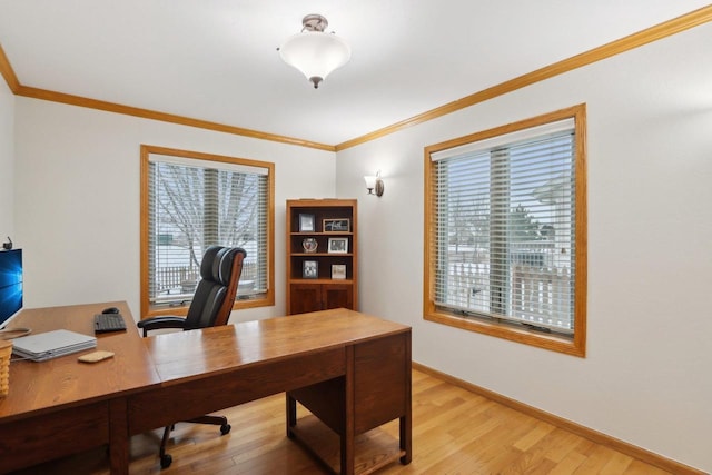 office featuring light wood-style floors, baseboards, and ornamental molding