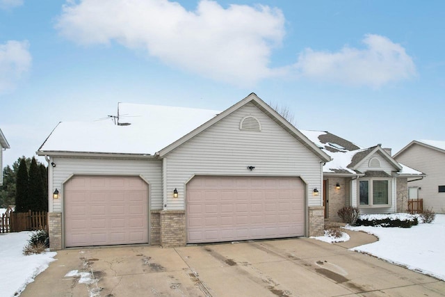 ranch-style house with a garage, concrete driveway, and brick siding