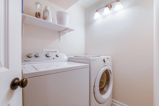 washroom featuring washing machine and dryer