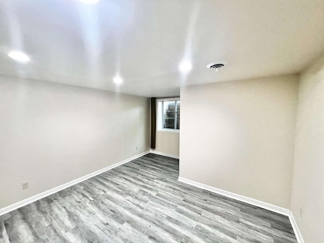 spare room with light hardwood / wood-style floors