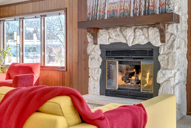 room details with wood walls and a fireplace