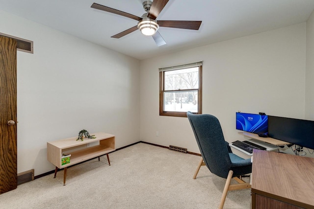 home office with light carpet and ceiling fan