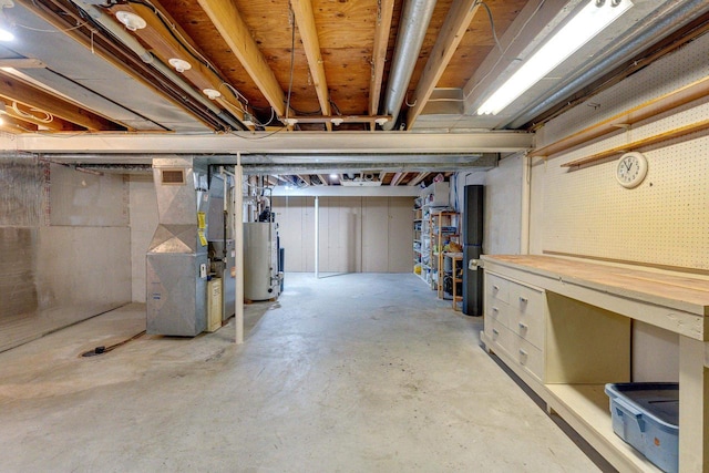 basement featuring heating unit and gas water heater