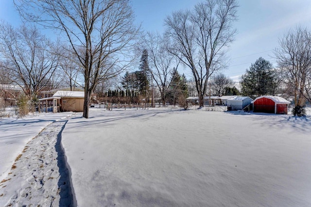 view of yard layered in snow