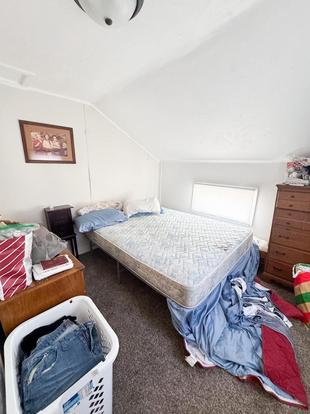 carpeted bedroom featuring vaulted ceiling